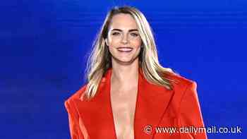 Cara Delevingne sets pulses racing as she go braless beneath a dramatic red coat with VERY skimpy hot pants at L'Oreal show amid PFW