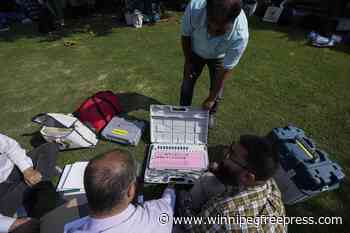 Residents in India-controlled Kashmir vote in the second phase of polls surrounded by heavy security