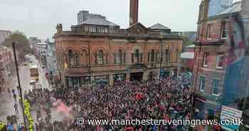 Dutch football fans bring some of city's busiest streets to a standstill during loud and noisy march to Old Trafford