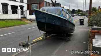 Search for owner of boat dumped in street