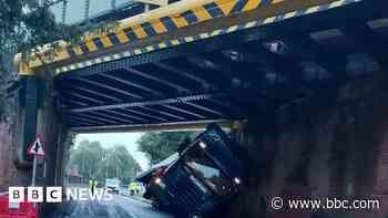 Rail and road delays as lorry gets stuck under bridge