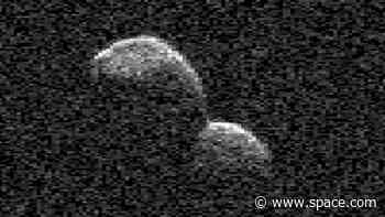 Radar images capture snowman-shaped object tumbling past Earth