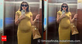 Sonnalli oozes pregnancy glow in a yellow dress