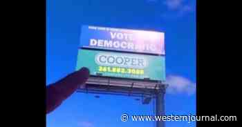 Gun Coating Company Takes Action When 'Vote Democratic' Billboard Appears Above Shop