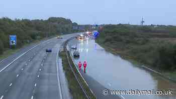 Drivers rescued on M5 after floods leave them stranded in their cars as downpours leave roads and railways under water - latest news