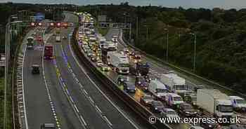 M5 traffic LIVE: Motorway closure triggers four mile queues as cars stranded in floods