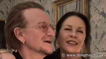 Catherine Zeta-Jones, 55, shows off her impressive vocals as she joins U2's Bono to serenade husband Michael Douglas, 80, as the couple celebrate their joint birthdays