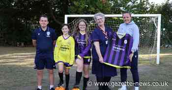 Colchester United player helps unveil new kit design by school students