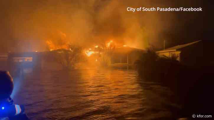 Watch: Florida home goes up in flames in dangerous flooding