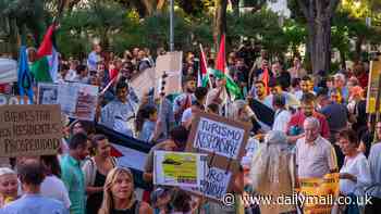 The party's over! Fury in Ibiza as 1,000 anti-tourism protesters are joined by Free Palestine zealots as they march through the streets calling for Brits to leave the globe's clubbing capital