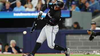 Marlins strike early, crush Blue Jays 15-5