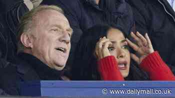 Salma Hayek puts on a very animated display with husband François-Henri Pinault as they enjoy a football game in Paris