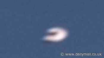 Chilling video shows' 'horseshoe-shaped' UFO defying laws of physics after photo of similar craft shot down over Yukon is declassified