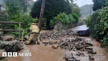 Clean-up work starts after heavy rain and floods