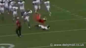 Shocking moment college cheerleader kicks Oklahoma player in the head