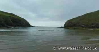 The perfect secluded beach with symmetrical cliffs that looks like a painting