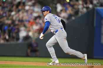 Ohtani has 2 hits to close on batting leader Arraez in Triple Crown bid as Dodgers beat Rockies 13-2