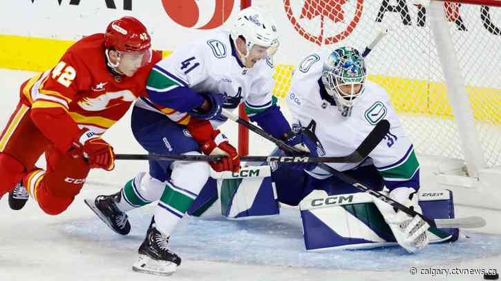 Flames remain hot in pre-season, beat Canucks 4-2