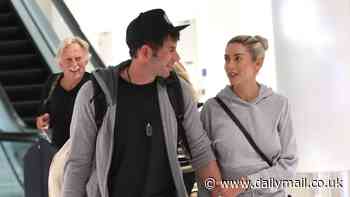 Tarek El Moussa holds hands with wife Heather Rae Young as they jet into LA - after opening up about filming new show with ex Christina Hall