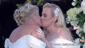 Rebel Wilson and new wife Ramona Agruma look incredible in near-identical wedding dresses as they share a kiss in first images from 'super romantic' ceremony in Sardinia