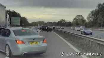 Moment trailer crashes on the motorway sending FRIDGES flying everywhere - sparking six miles of traffic