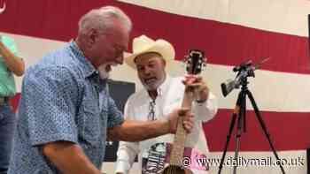 Taylor Swift guitar is SMASHED by elderly man who had just spent $4K for the signed instrument at charity auction