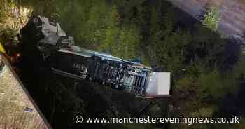 Driver rescued after lorry smashes through barrier and plummets 60 metres off M6 Thelwall Viaduct