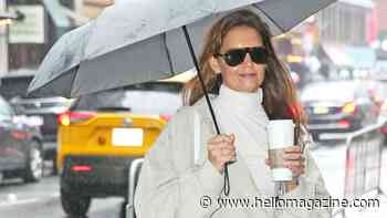 Katie Holmes nails city chic in trench coat and snakeskin boots as she arrives for her matinee performance