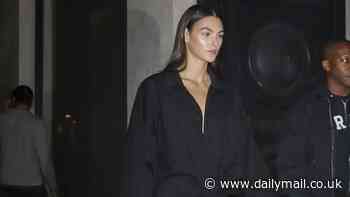 Leonardo DiCaprio's girlfriend Vittoria Ceretti cuts a chic figure in a black shirt dress as she steps out in Paris after attending Balenciaga show