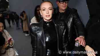 Lindsay Lohan poses up a storm in a black sequin dress at Balenciaga show during Paris Fashion Week