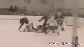 Shocking moment mass brawl breaks out on the ice: Hockey players held for 'hooliganism' and forced to hand over passports after violence erupts between teams in the rink