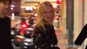 Kate Moss takes a tumble while enjoying a cigarette outside Paris restaurant at her daughter Lila Moss' birthday - before laughing off the awkward moment