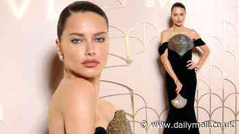 Adriana Lima turns heads in a velvet gown while Natalia Vodianova stuns in a diamante cut out dress as they lead the glamourat the Bvlgari show during Paris Fashion Week