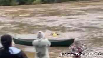 Heartstopping moment North Carolina man jumps into surging floodwaters after spotting woman trapped in debris