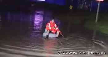 Man filmed navigating flooded streets in inflatable chair