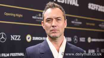 Jude Law cuts a suave figure in a double breasted suit and scarf at screening of his new movie The Order as it opens the Zurich Film Festival