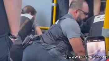 Shocking moment young man is pinned to the ground by five ticket inspectors during dramatic arrest on Melbourne bus