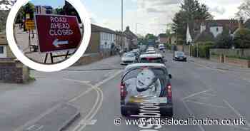 Car and lorry crash partly blocks road