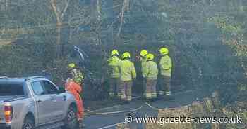 Firefighters rescue two people stuck in a ditch after two vehicle crash