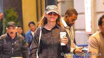 Katie Holmes flashes a smile during a coffee run in NYC... after receiving great reviews for her performance in the Broadway run of Our Town