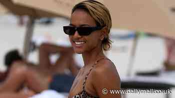 Karrueche Tran bares her bombshell bikini body as she soaks up the sun in Miami Beach