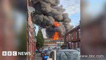 Crews tackle fire that led to huge plumes of smoke