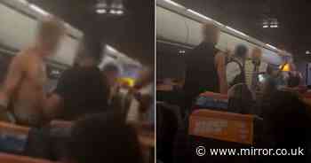 Moment brawling easyJet passenger rips shirt off as captain begs him to stop