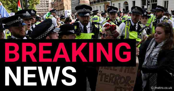 Protesters clash with police cordon after thousands march through central London