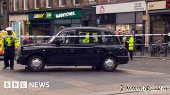 Three people in hospital after taxi hits pedestrians