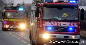 Log pile fire spreads to garage in North Yorkshire village