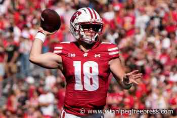 Locke throws for 359 yards and 3 TDs as Wisconsin steamrolls slumping Purdue 52-6