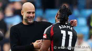 Pep Guardiola is filmed 'coaching' Adama Traore on the pitch after the winger missed a pair of clear cut chances in Manchester City's win over Fulham