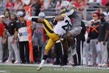 No. 3 Ohio State sputters in the first half before blowing out Iowa 35-7