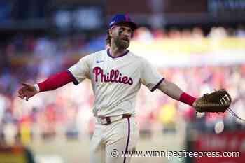 Mets use another October rally to score 5 runs in 8th and top Phillies 6-2 in Game 1 of NLDS